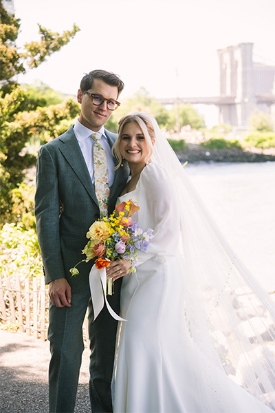 Couple standing together in wedding attire