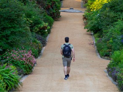 student walking through Duke Gardens