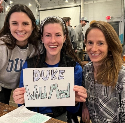 Duke Wild Med leaders holding organization sign