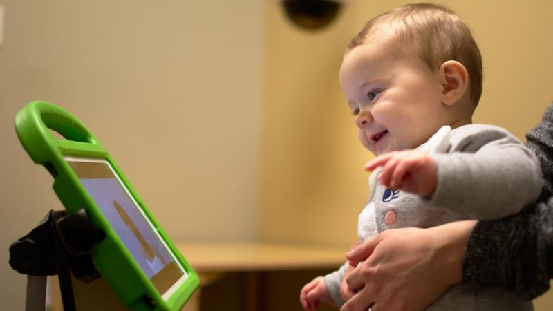 baby looking at computer screen
