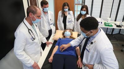 Duke University School of Medicine students practice their training with a patient