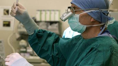 Surgeon performing a glioblastoma biopsy