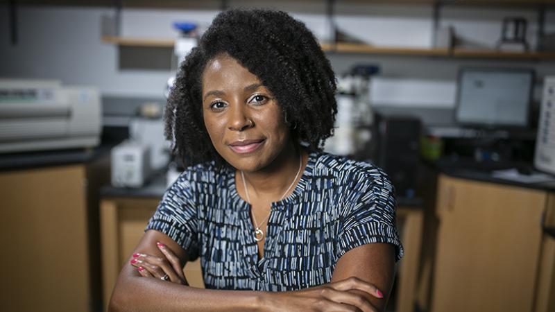 portrait of woman sitting in lab
