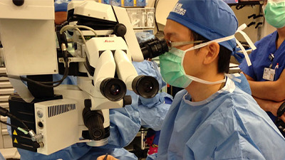 Dr. Paul Hahn performs a high definition scan on the left eye of patient