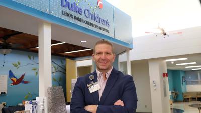 man standing in lobby of Children's hospital