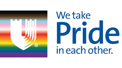 Rainbow flag behind the Duke Health U. We take PRIDE in each other. 