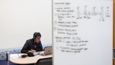 student on her computer in the Medical Center Library.