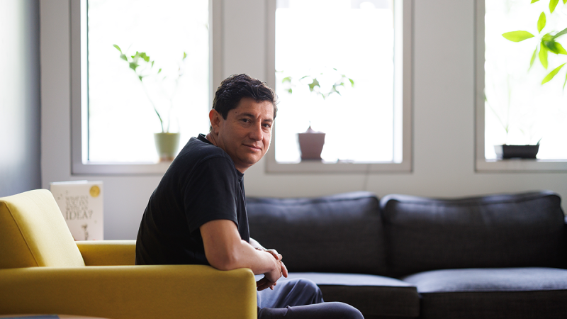 Diego Bohorquez, PhD sitting in an armchair in his lab