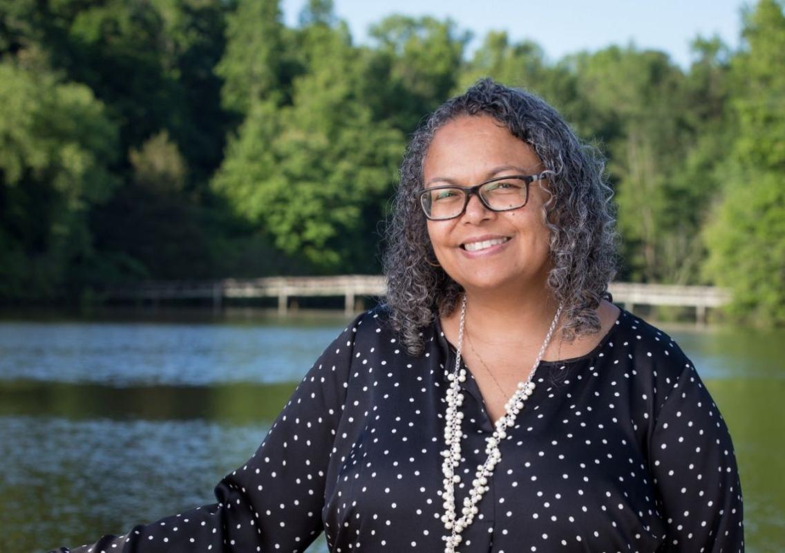 woman standing outside infront of water