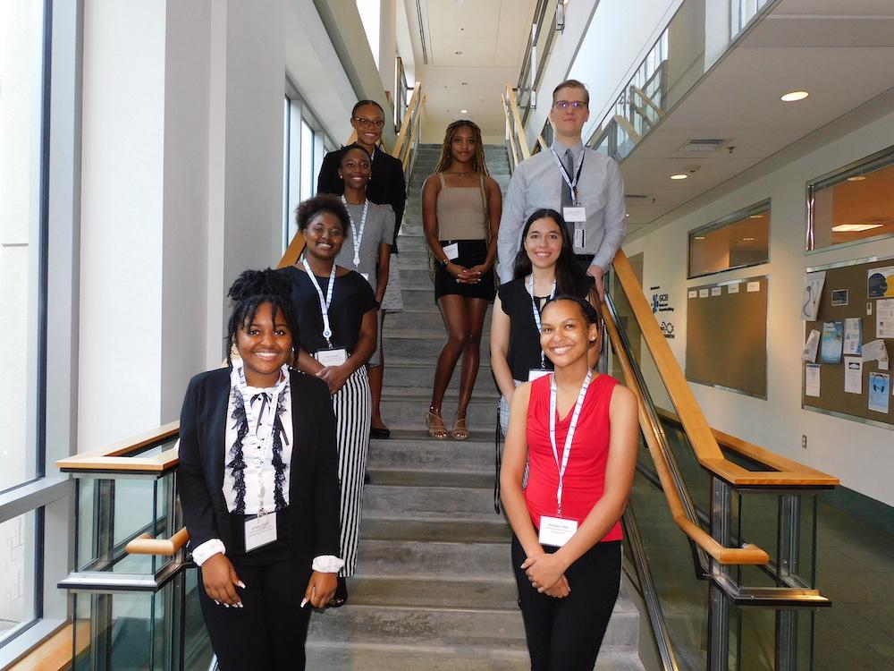 eight students standing on a staircase
