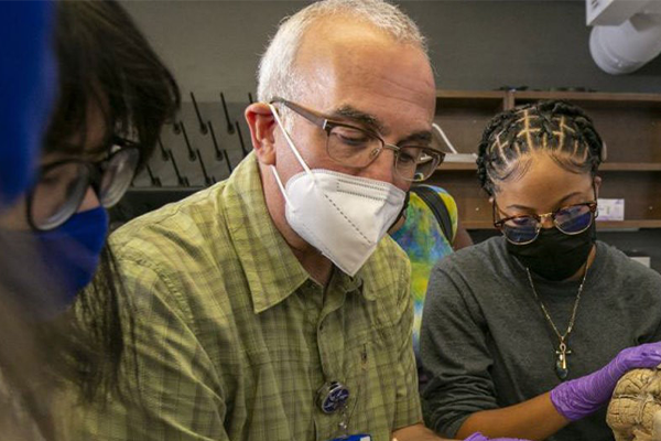 Len White looking a the human brain system with students