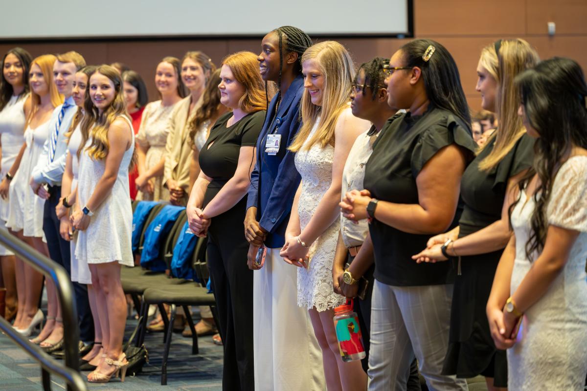 Group shot of line of students at commissioning ceremony
