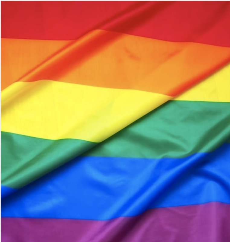A flag of red, orange, yellow, green, blue and purple