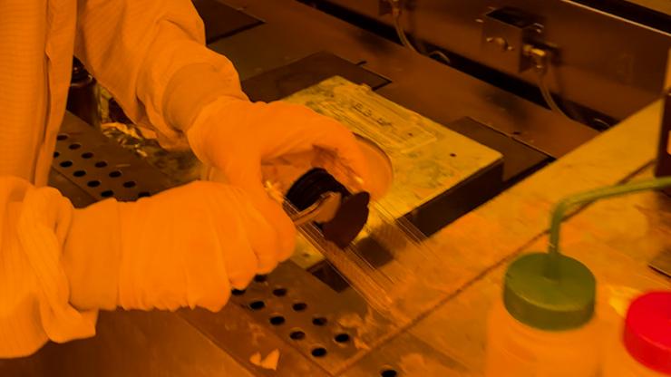 Jay Dalton prepares a silicon wafer for a microelectronics experiment
