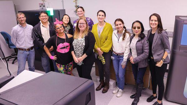 group of researchers standing in a lab