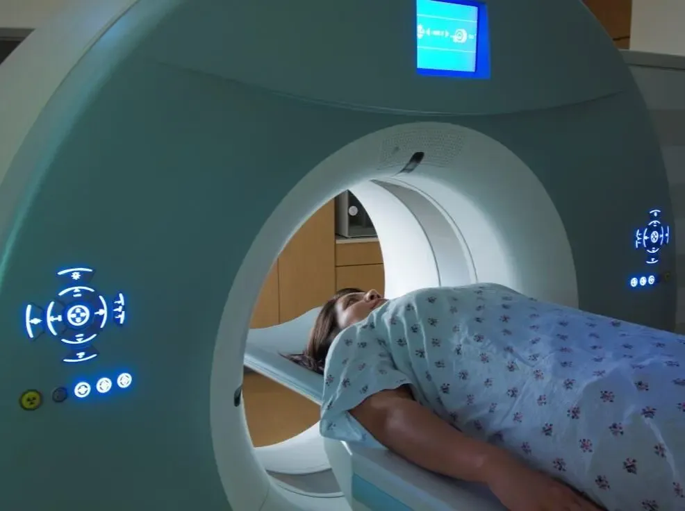 Photo of a woman entering an MRI machine