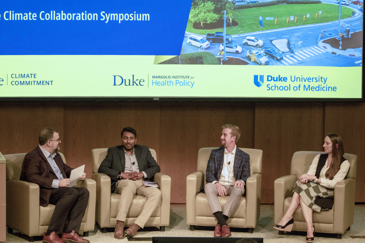 4 seated panelists attending the Duke Climate Collaboration Symposium. Robert Tighe, MD, associate professor of medicine and director of the School of Medicine’s Climate and Health Research Initiative, Nishad Jayasundara, PhD, Juli Plant Grainger Assistant Professor of Global Environmental Health, Stephen Colvill, MBA, assistant research director at the Duke-Margolis Institute for Health Policy,  Coral Giovacchini, MD, assistant professor of medicine, Photographs by Weiyee Mock 