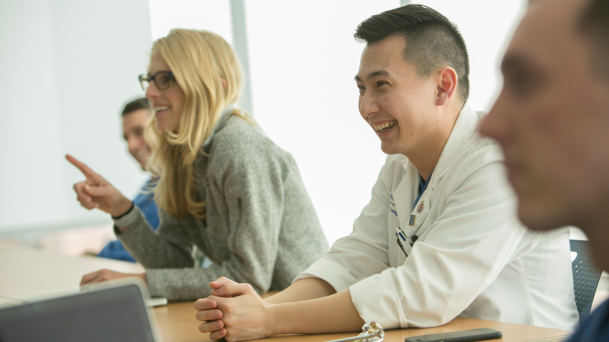 Students smile as they listen in class