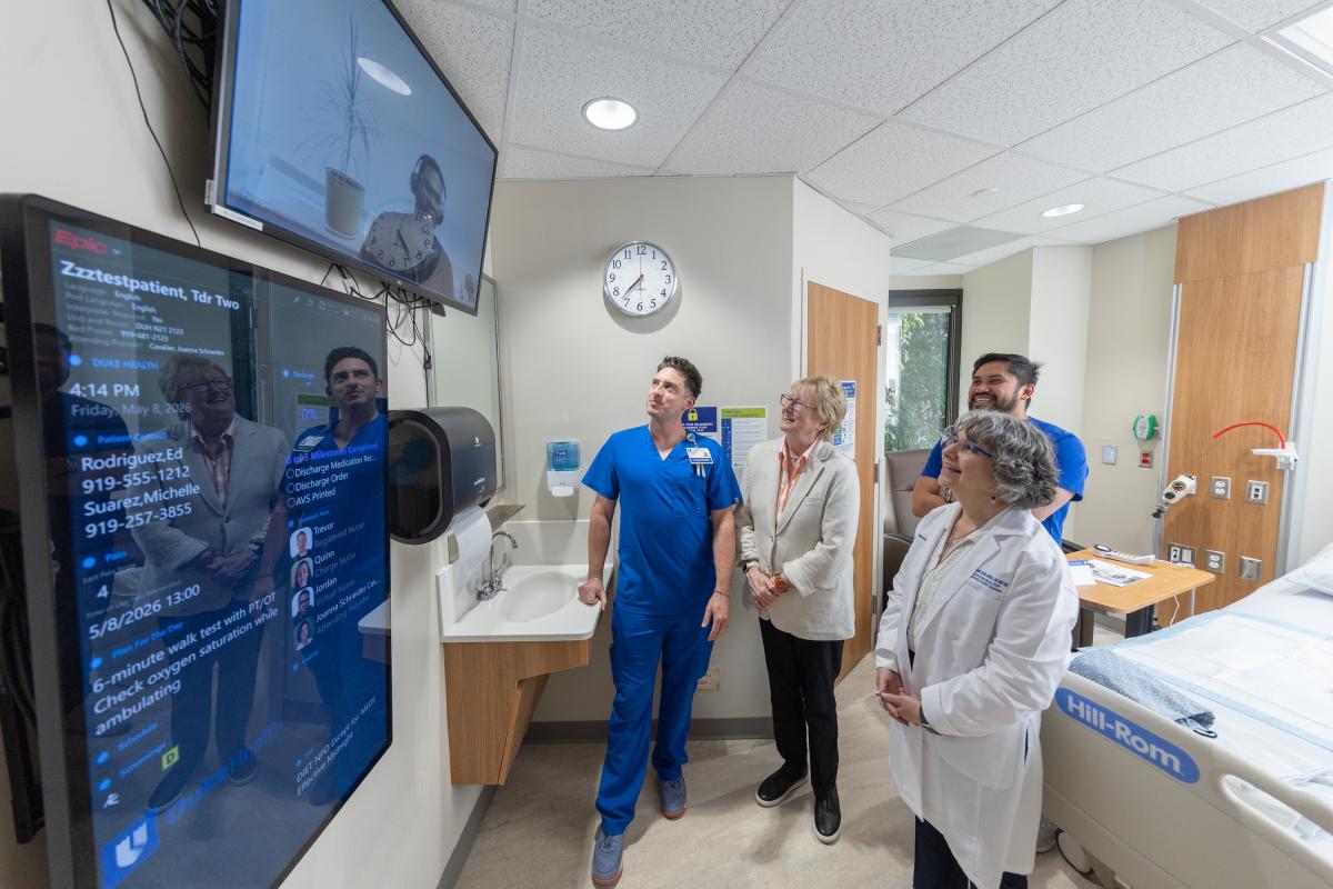 Nancy Schlichting and Terry McDonnell in an innovative hospital room with three nurses. 