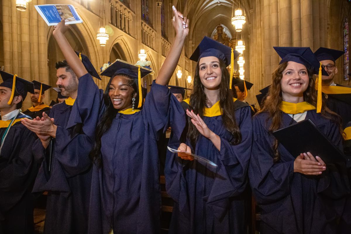 Duke PA students celebrating and clapping for graduation