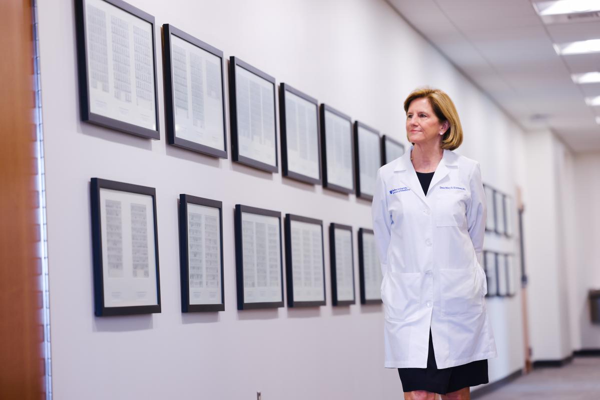 Dean Klotman walking down a hallway