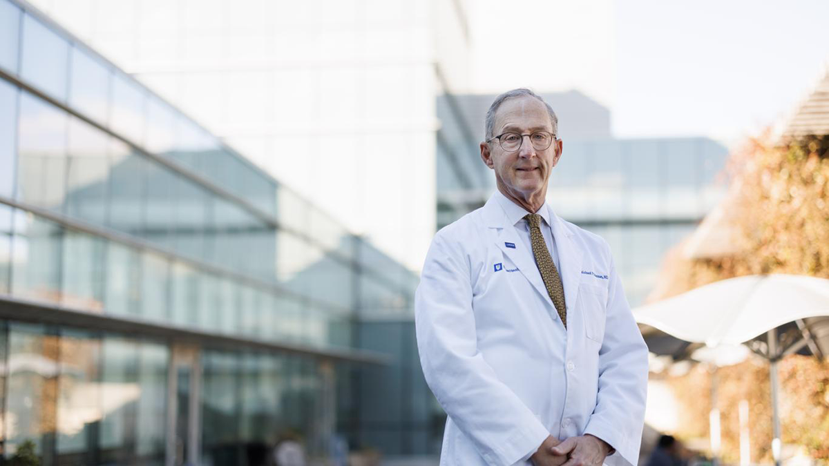 Richard Shannon standing in front of Duke Health building.