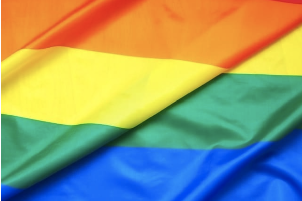 A flag of red, orange, yellow, green, blue and purple