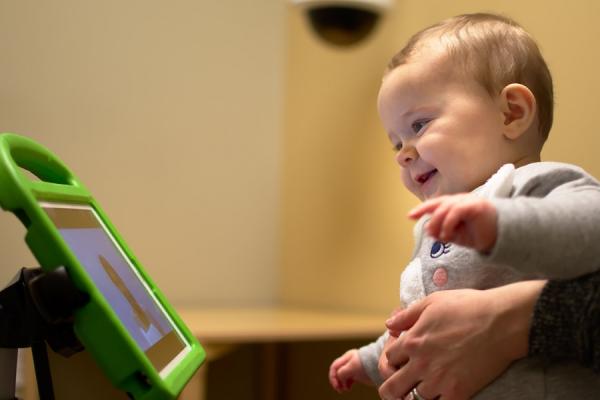 baby looking at computer screen