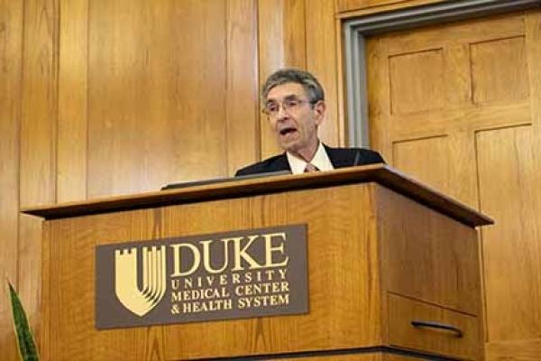 Robert Lefkowitz, MD at a podium