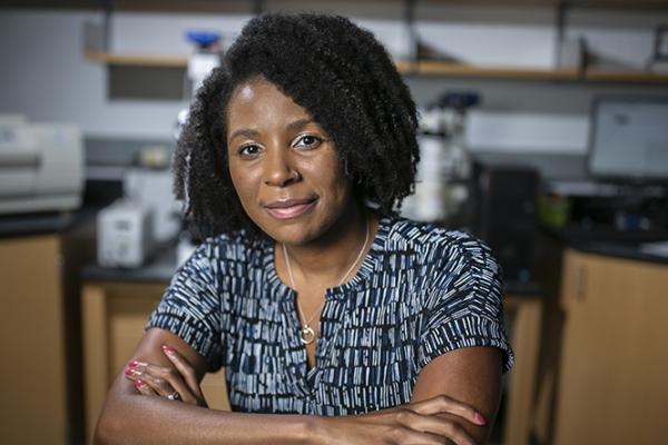 portrait of woman sitting in lab