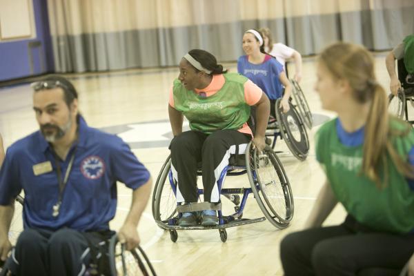 students playing wheelchair basketball 