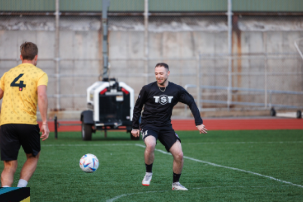 Two men on a soccer pitch