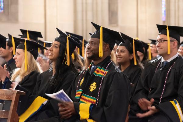 Class of 2023 graduates sitting in Duke Chapel