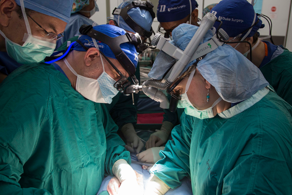 Debra Sudan and other surgeons performing a transplant surgery. 