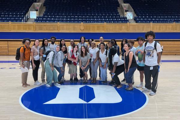 Shot of the SDP group at the Duke basketball floor arena