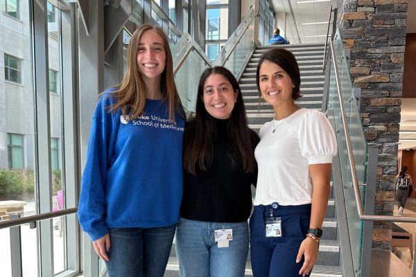 Three OTD students on the stairs at the IPE Building 