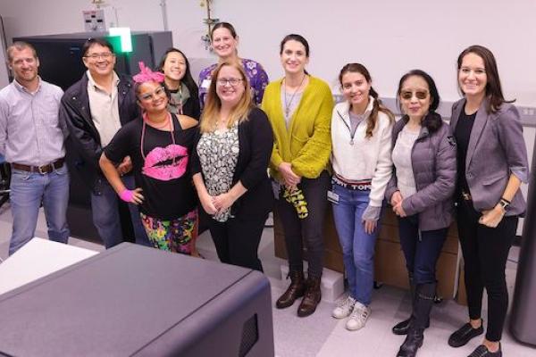 group of researchers standing in a lab