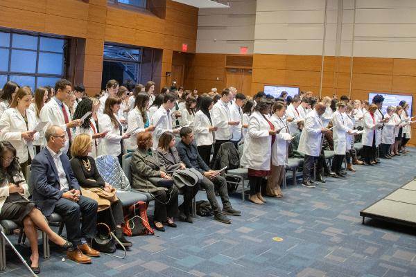 Class of 2025 standing for their oath