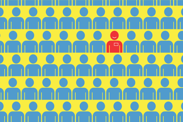 A group of cartoon people on a yellow blackground. One stands out among the rest.