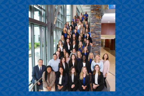 dozens of students, staff and faculty posing for a group photo