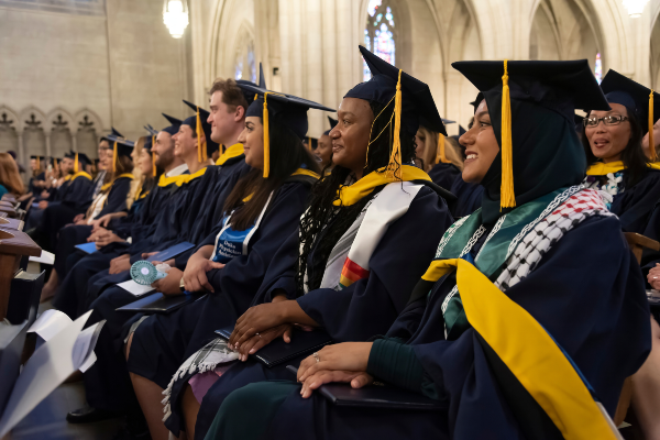 Row of students in graduation attire in Duke Chapel