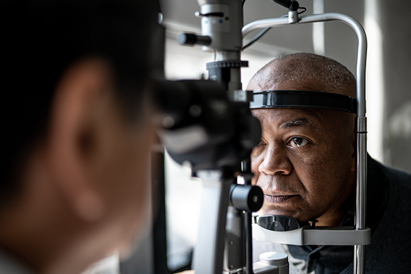 Black male patient receiving an eye exam