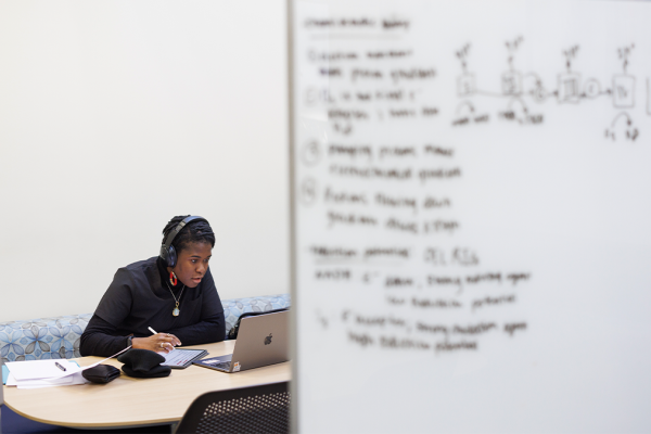 student on her computer in the Medical Center Library.