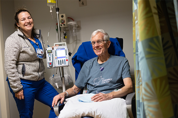 Steve Smith receives an infusion of a new medication to treat Alzheimer’s from Kaitlin Gingue, BSN, RN, CNII