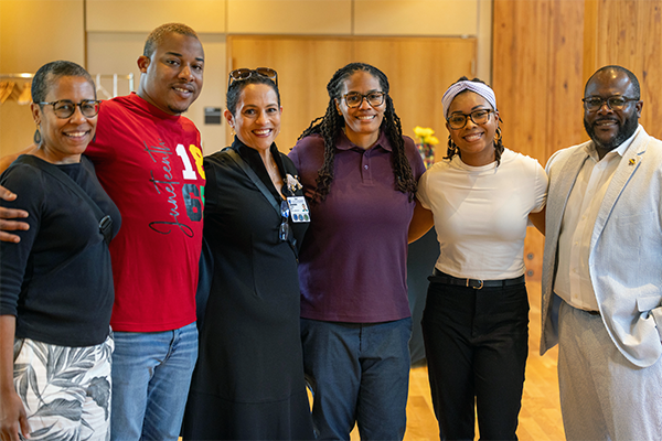 Members of the ME squared Black Employee Resource Group posing for a group photo at a Juneteenth event.