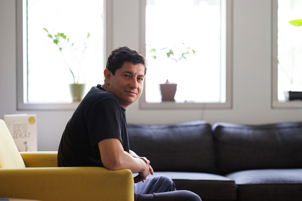Diego Bohorquez, PhD sitting in an armchair in his lab