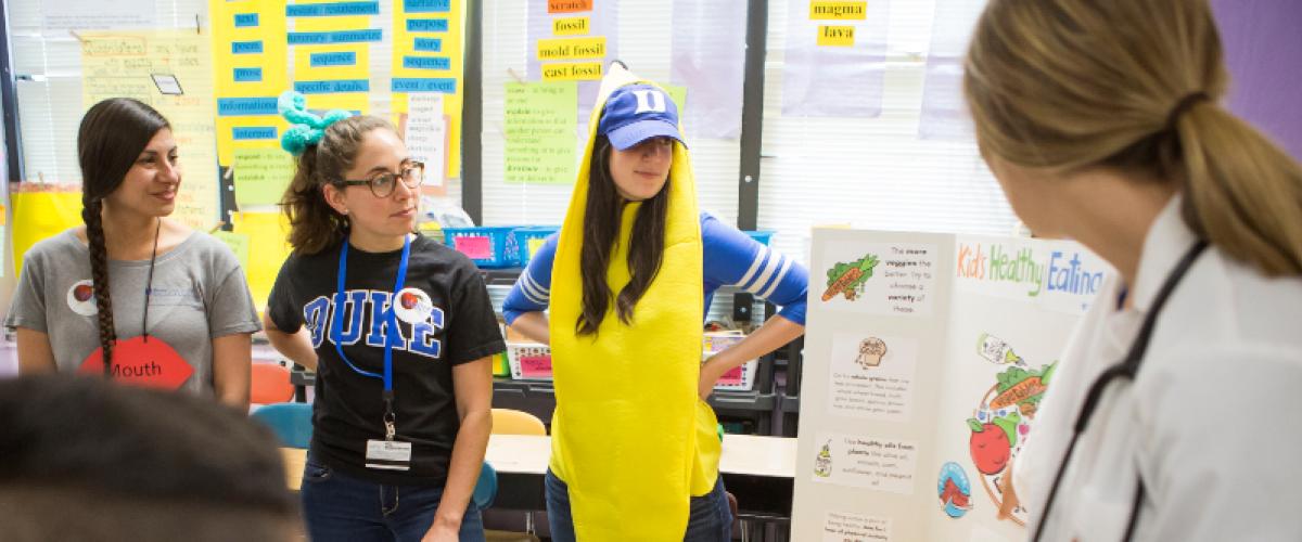 Duke PA Students giving presentation to elementary school students