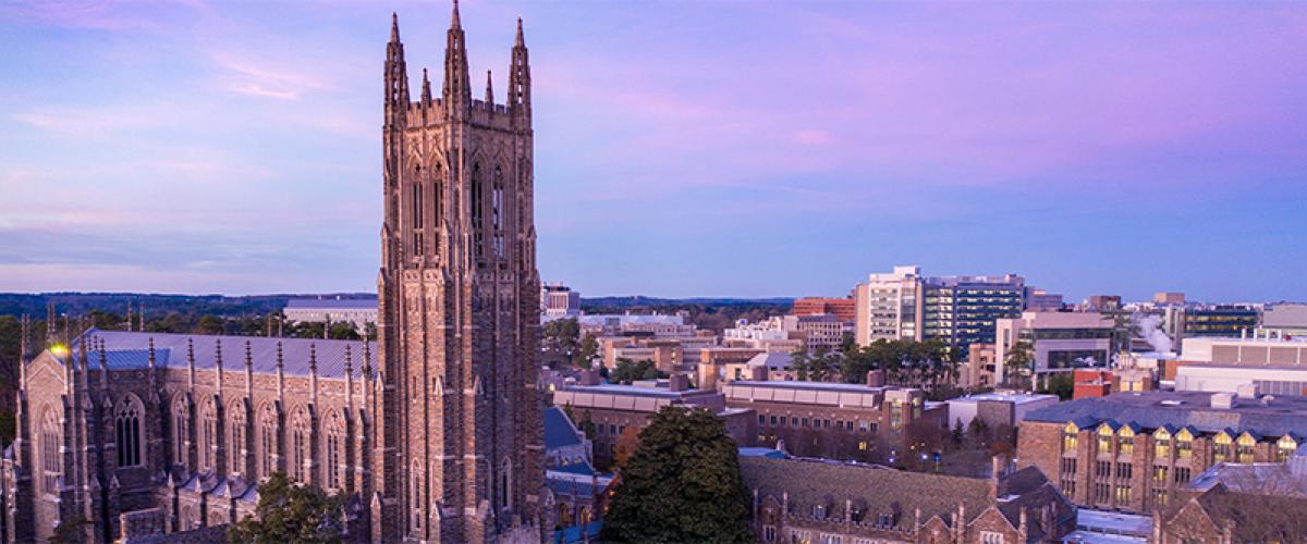 skyline view of Duke Chapel tower at dusk