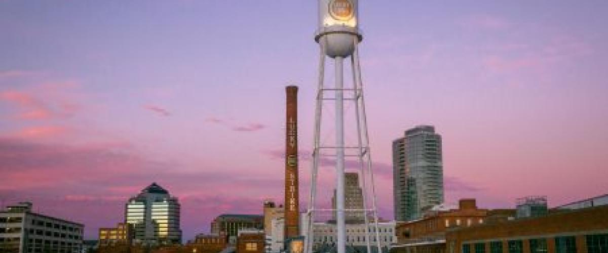 An image of downtown Durham at sunset