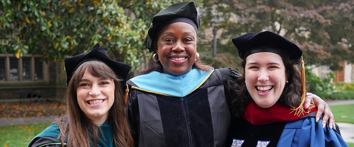 three duke otd faculty members in their graduation regalia